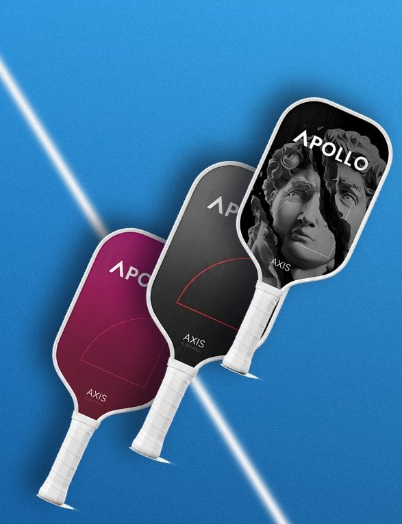 Three Apollo Axis pickleball paddles arranged neatly on a blue court surface, showcasing the blue/black, white/black, and pink/purple gradient color options.